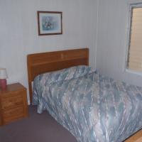 bedroom with full size bed and nightstand