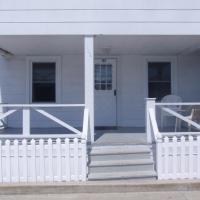 apartment exterior covered porch with chairs