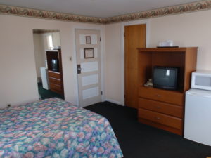 tv and kitchenette full size bed