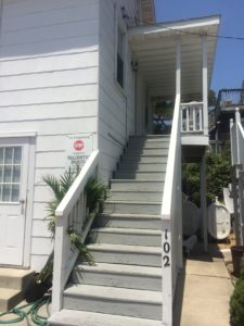 exterior stairs leading to apartment and balcony