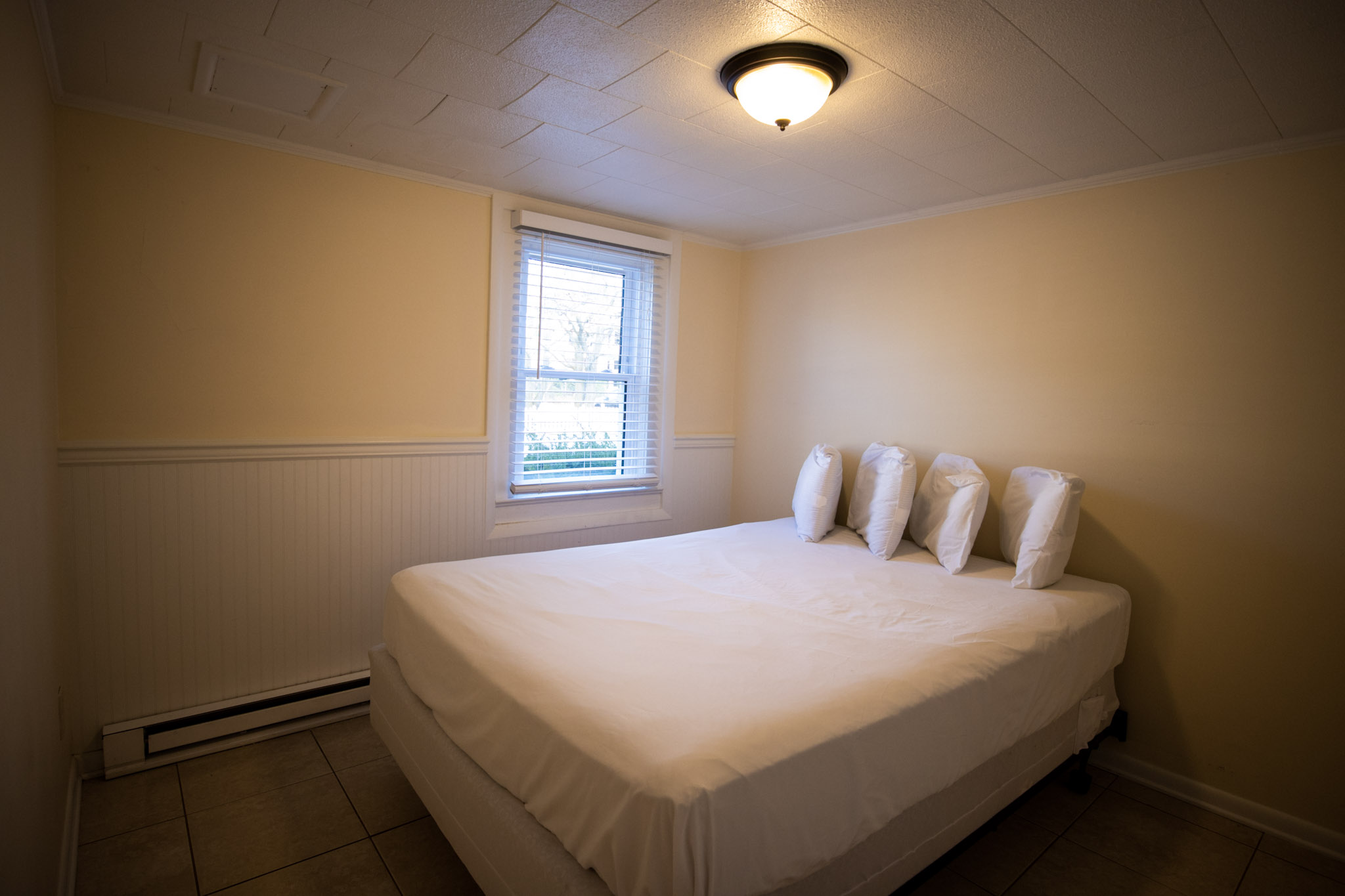 queen size bed in the two bedroom apartment at the Majestic Hotel in Ocean City, Maryland