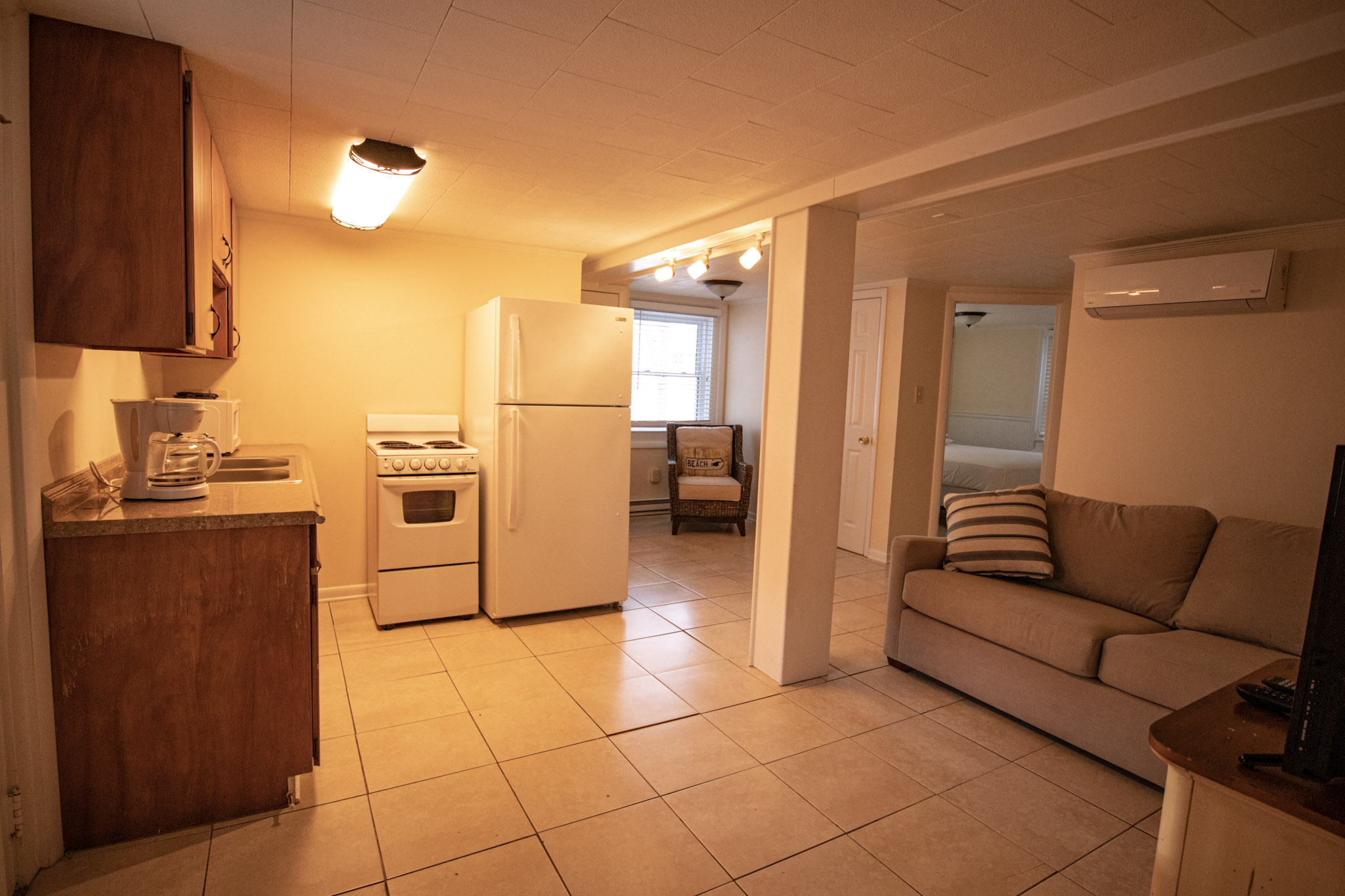 Spacious living room and kitchen in the two bedroom apartment at the Majestic Hotel in Ocean City, Maryland