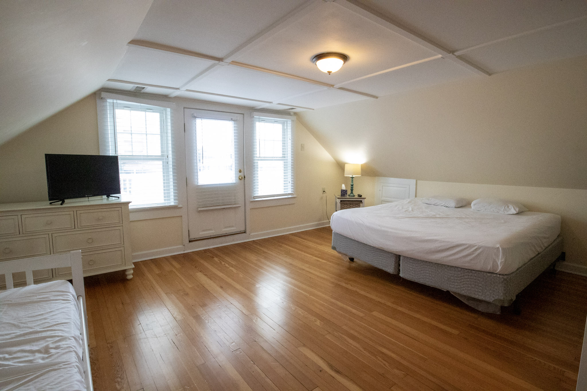 large bedroom with wood floors at the Majestic Hotel in Ocean City, Maryland