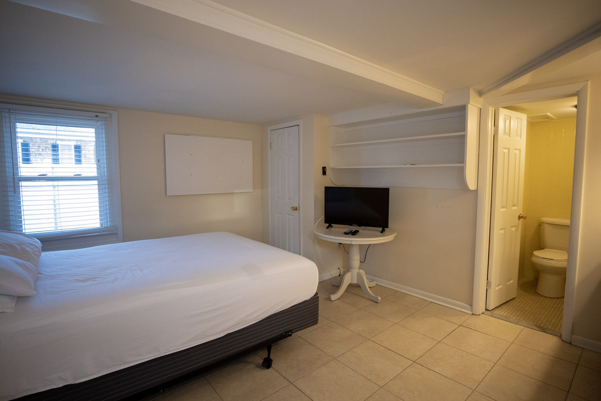 Studio apartment with full size bed and television at the Majestic Hotel in Ocean City, Maryland